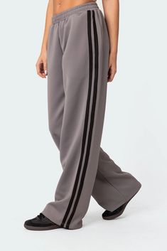 Track pants Contrast side stripe detailing Elastic waistband Polyester, Spandex Model wears size S Model height is 5'8 Item care: Wash with similar color Women Track Pants, Puma Track Pants, Grey Track Pants, Visionary Fashion, Track Pants Women, Jumpsuit Jacket, Style Savvy, Swimwear Dress, Denim Design