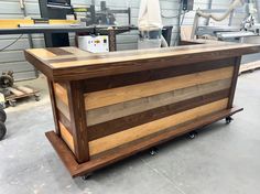 a wooden counter sitting inside of a garage