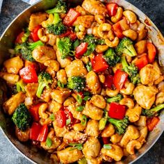 chicken and broccoli stir fry in a skillet on top of a table