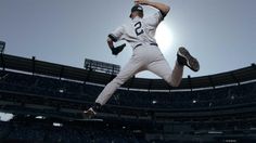 a baseball player is jumping in the air