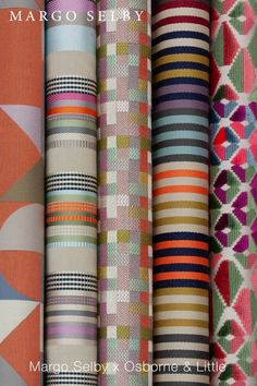 colorful fabrics are lined up in rows and on display with the words, margo sely