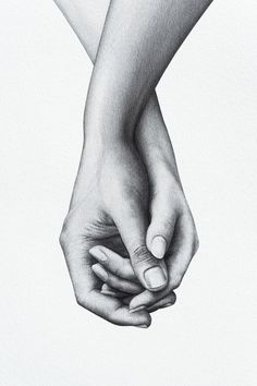 two hands are holding each other in black and white