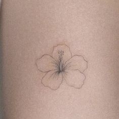 a flower on the side of a woman's stomach