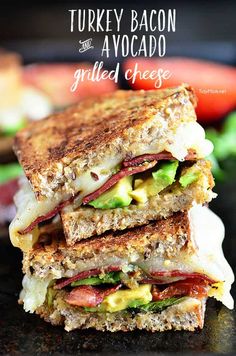 turkey bacon and avocado grilled cheese sandwich stacked on top of each other