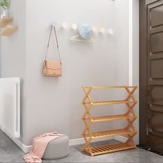 a white room with a wooden shelf next to a radiator