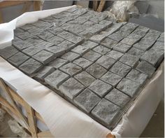 the table is covered with gray stone tiles