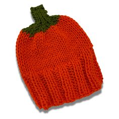 an orange knitted beanie with a green leaf on it's tip, against a white background