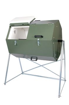 a large green cooler sitting on top of a metal stand