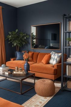 a living room with blue walls and orange furniture