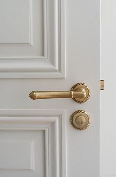 an open door with a handle on the front and side of it, in gold