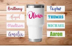 personalized tumbler cup with name stickers on wood background for customizing gifts