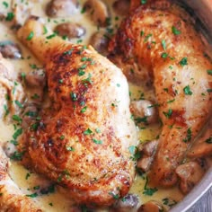 a close up of chicken and mushrooms in gravy