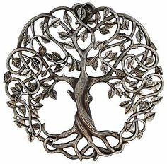 the tree of life has many branches and leaves on it's sides, as well as an intricate design