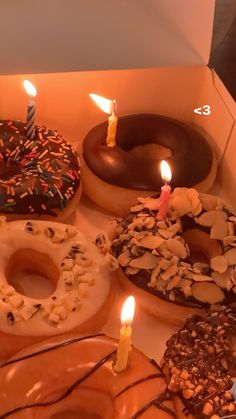 a box filled with lots of different types of doughnuts