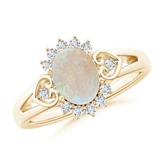 Inspired by vintage designs, this breathtakingly beautiful ring is crafted in 14K Solid Gold and features a sublime oval opal at its center. The fascinating opal brings out a reaction of wonder and awe with its celestial hues. Glistening diamonds form a radiant halo around the center stone and scroll heart motifs adorn the split shank of this vintage opal ring. Birthstone for the month of October and traditional gemstone gift for 12th, 14th, 21st, 34th & 43rd wedding anniversaries. All our items Heirloom Diamond Opal Ring Oval Shaped, Elegant Opal Ring In White Gold With Oval Shape, Gold Opal Ring With Halo Design In Oval Shape, Oval Opal Ring With Intricate Design For Wedding, Gold Opal Ring With Halo Design, Oval Shape, Opal Heart Ring, Radiant Halo, 14th Wedding Anniversary, Opal Ring Vintage