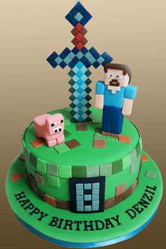 a birthday cake decorated with an image of two people in front of a pixelated cross