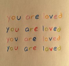 the words you are loved and you are loved written in colored crayons on white paper