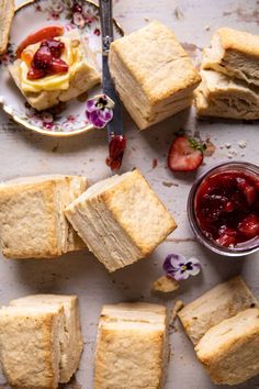 several pieces of bread with jam on the side