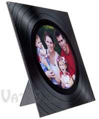 a black record with an image of two people and a baby in it is shown