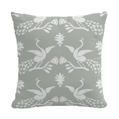 a grey and white pillow with birds on it