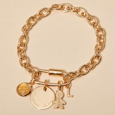 Level up your bracelet game with our Personalized Lucky Charm Bracelet, a chunky chain with added meaning. This bracelet features a screw clasp oval locket, ready to fill with precious charms and dedications of love. Mix and match between discs, letters and birthstones to create a one-of-a-kind personalized bracelet that shines just as uniquely as you do.&nbsp;18K Champagne Gold PlatedMini Flat Disc: 1x1cmSmall Flat Disc: 1.5x1.5cmMedium Flat Disc: 1.9x1.9cmMini Disc, Mini Star, Mini Heart, Bracelet Game, Lucky Charm Bracelet, Alphabet Charm, Oval Locket, Mini Charm, Grandmother Gifts, Pearl Collection, Crystal Stars, Classy Jewelry