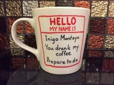 a coffee cup with writing on it that says, hello my name is lingo manoya you drank my coffee prepare to die