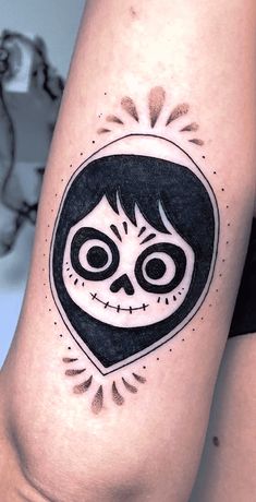 a woman's leg with a tattoo design on it