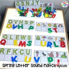 the letter sound match is displayed on a table with letters and numbers in front of it