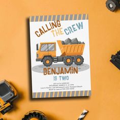 a children's book called calling the crew by benjamin is next to construction equipment