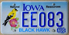 a license plate that says iowa ee083 black hawk with a bird on it