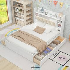 a white bed sitting in a bedroom next to an open book shelf on top of a rug