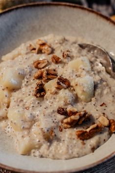 a bowl of oatmeal with bananas and nuts