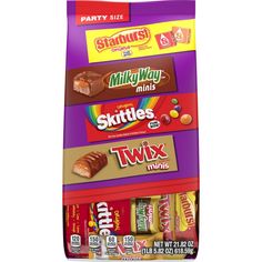 three bags of skittles and twix minis are stacked on top of each other