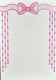 a white card with pink ribbon and bow on it's side, hanging from the ceiling