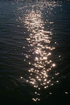 the sun shines brightly on the water as it reflects off the surface of the water