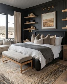 a bedroom with black walls and white bedding