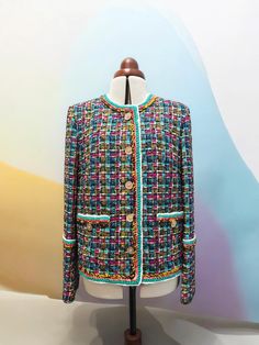 Elevate your style with our exquisite Handmade Tweed Boucle MultiColored Jacket featuring a touch of sophistication and flair. Handcrafted with care and attention to detail, this jacket is a true testament to timeless craftsmanship. The intricate blend of multicolored tweed woven fabric adds a vibrant and unique touch to this classic piece. Adorned with a single striking gold button, this jacket exudes elegance and charm, making it a versatile addition to your wardrobe. Whether you're looking to Multicolor Tweed Jacket For Work, Chic Outerwear, Gold Buttons, Handmade Fashion, Tweed Jacket, Woven Fabric, Jackets For Women, Jackets & Coats, Bathing Beauties