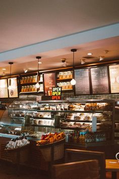 the inside of a bakery with lots of food