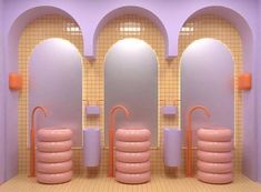 the bathroom is decorated in pastel colors and features round shaped sinks, pink bathtubs, and circular mirrors