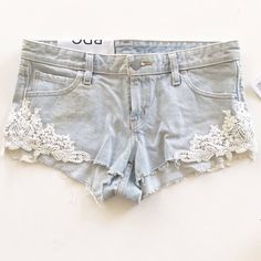 Elevate Your Festival Or Bohemian Style With These Bdg Lace Dolphin Low Rise Jean Denim Embroidered Shorts. Made From 100% Cotton Denim Fabric, These Shorts Feature A Blue Color With Lace Accents And A Cut-Off Style. The Size Is 25 Inches In Waist Size And Is Regular Fit. Perfect For Travel Or Casual Occasions, These Shorts Are A Classic Addition To Your Wardrobe. The Dolphin Embroidery Adds A Touch Of Charm To The Overall Design. Made In Mexico, These Shorts Are A Must-Have For Any Fashion-Forw Summer Denim Bottoms With Lace Trim, Denim Bottoms With Lace Trim For Summer, Dolphin Embroidery, Nyc Wardrobe, Denim Shorts With Lace, Low Rise Jean Shorts, Lace Denim Shorts, Low Rise Jean, Adorable Outfits