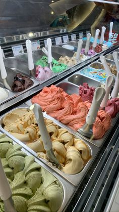 an assortment of different flavored ice creams in trays