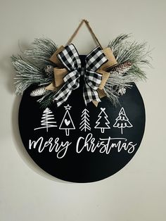 a merry christmas sign hanging on the wall