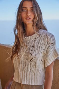 The Cali Crochet Sweater is the perfect way to top off your fav jeans, shorts, or flowy pants this season. Featuring a round neck and short sleeves, this chic knit top will take you from work to happy hour with ease. 96% Cotton 4% Nylon Color: Cream Calia Sweater, Neutral Sweaters, Ivory Sweater, Club Tops, Crochet Round, Trendy Boho, Short Sleeve Sweater, Beautiful Sweater, Cotton Crochet