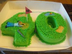 a birthday cake that is shaped to look like the number 50 with a golf theme