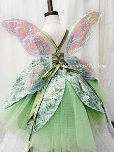 a dress made to look like a fairy's wings and green tulle skirt