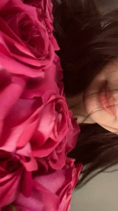 a close up of a woman with flowers in her hair