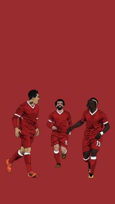 three soccer players in red uniforms are running on a red background and one is holding the ball