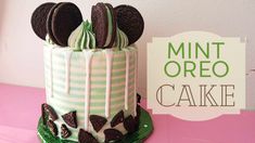 there is a cake with oreo cookies on it and a sign that says mint oreo cake