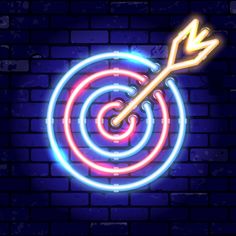 an arrow in the center of a dart's target neon sign on a brick wall