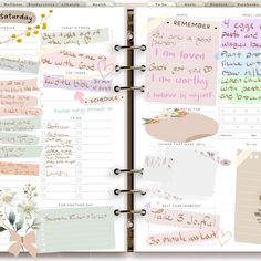 an open planner with notes and flowers on it